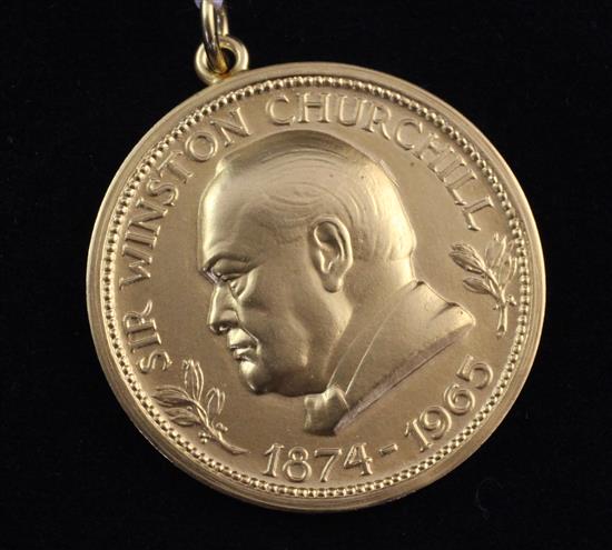 A 1960s 9ct gold Winston Churchill commemorative medallion, 14 grams.